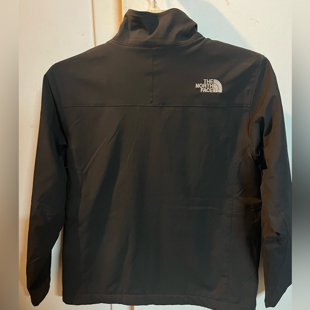 The North Face boys black jacket size 10/12.
